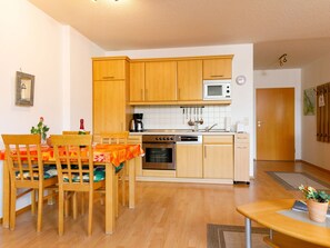 Cabinetry, Furniture, Countertop, Property, Table, Kitchen, Home Appliance, Wood, Kitchen Stove, Orange
