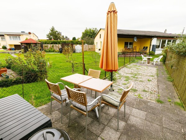 Plant, Building, Property, Sky, Furniture, Outdoor Furniture, Shade, Wood, Chair, Tree