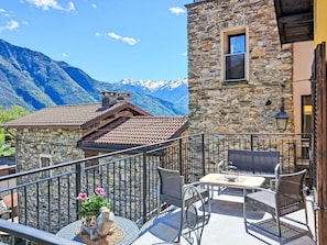 Sky, Cloud, Property, Building, Furniture, Window, Azure, Mountain, Flowerpot, Table
