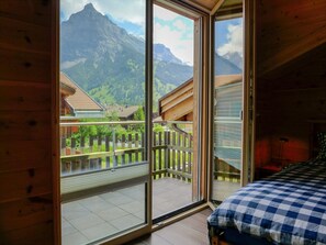 Sky, Property, Building, Interior Design, Mountain, Shade, Wood, Floor, Fence, Comfort
