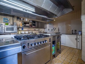 Cabinetry, Kitchen Appliance, Kitchen Stove, Kitchen, Countertop, Gas Stove, Stove, Wood, Floor, Flooring