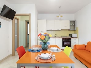 Table, Furniture, Property, Cabinetry, Couch, Orange, Living Room, Interior Design, Chair, Wood