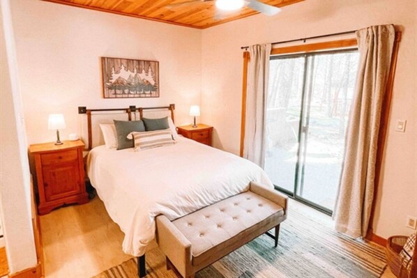 Spacious queen size bed comfortably sleeps 2.