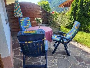 Plant, Furniture, Chair, Outdoor Furniture, Wood, Outdoor Table, Armrest, Leisure, Shade, Tree