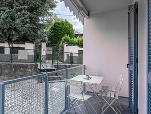 Table, Building, Chair, Shade, Tree, Outdoor Furniture, Condominium, Outdoor Table, Flooring, Real Estate