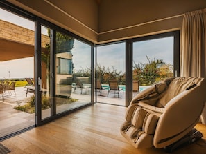 Plant, Building, Wood, Interior Design, Comfort, Shade, Flooring, Living Room, Floor, Chair