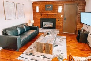 Cozy gatherings by the fire await in our inviting living area.