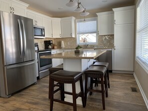 Kitchen with island that seats six