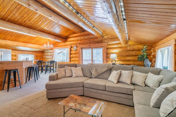 Upstairs Living Room with Spacious Sofa and Open Floor Plan