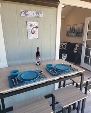 Enjoy a romantic dinner outside with protection from the screened in porch