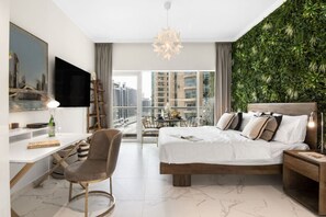 Stylish Suite: Enjoy paUrban Oasis: Experience vibrant cityscape views and modern elegance in this stunning suite!noramic city views from this modern space with chic decor!