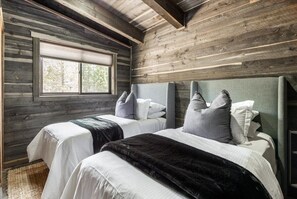Enjoy comfort and convenience in the twin room. It features two cozy twin beds, perfect for a peaceful night's sleep or accommodating additional guests.