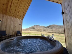 Hot tub out back with a beautiful view.