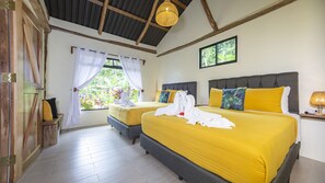 Indulge in luxury and tranquility in our main bedroom, boasting an ensuite bathroom and breathtaking views of the lush rainforest garden. Your ultimate escape awaits!