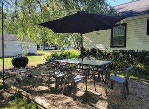 Outdoor Dining Area with Charcoal BBQ Grill