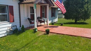 Relax on the front porch while admiring the country views