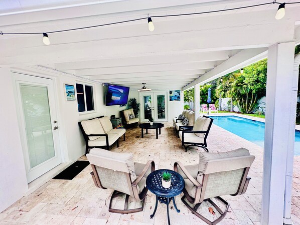 Heated pool, 78” Smart Tv , grill, patio dining table, lounge chairs, etc.