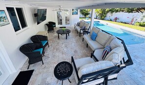 Heated pool, 78” Smart Tv , grill, patio dining table, lounge chairs, etc.