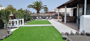 Private garden, with BBQ area, & seating for alfresco dining.  