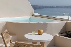 Private balcony with partial sea view and hot tub