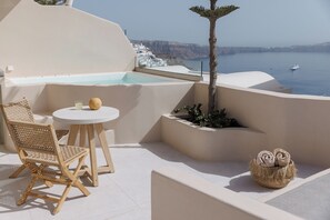 Private balcony with partial sea view and hot tub
