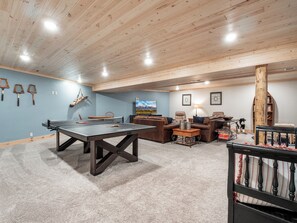 Challenge friends to a game of ping pong or unwind in the cozy entertainment space—this basement is designed for fun, relaxation, and making memories!