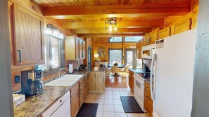 Walk into the kitchen, fully stocked for your convenience.