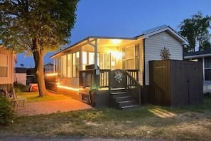 Front exterior showing front deck and add-a-room