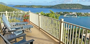 Outdoor furniture includes chairs, loungers, side tables and dining table.