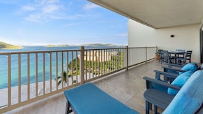 Chairs, loungers, side tables, and dining table. Enjoy the views!