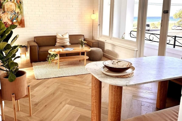 Living space with expansive Currumbin beach views.  Enjoy breakfast at our built in breakfast bar while watching the surfers enjoy the waves out the front.