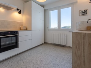 Cabinetry, Countertop, Building, Window, Kitchen, Lighting, Wood, Kitchen Appliance, Flooring, Interior Design