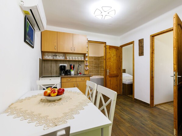 Furniture, Property, Cabinetry, Table, Countertop, Interior Design, Wood, Lighting, Orange, Flooring