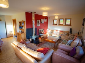 Furniture, Picture Frame, Property, Couch, Wood, Orange, Interior Design, Living Room, Comfort, Television