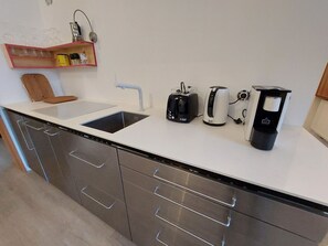 Cabinetry, Tap, Countertop, Drawer, Kitchen, Plumbing Fixture, Wood, Shelving, Floor, Material Property