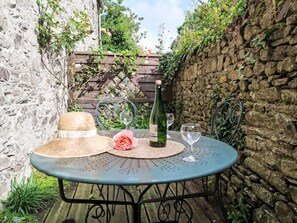 Table, Furniture, Plant, Bottle, Outdoor Table, Outdoor Furniture, Chair, Grass, Flowerpot, Sky