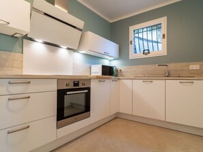 Cabinetry, Countertop, Property, Furniture, Kitchen Sink, Building, Window, Tap, Kitchen Stove, Kitchen