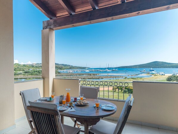 Sky, Table, Furniture, Property, Water, Chair, Building, Azure, Shade, Seaside Resort