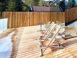Tree, Wood, Plant, Outdoor Furniture, Wood Stain, Fence, Hardwood, Grass, Shade, Plank