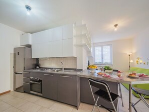 Cabinetry, Furniture, Countertop, Building, Wood, Kitchen Stove, Kitchen, Flooring