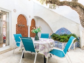 Furniture, Plant, Property, Table, Building, Chair, Azure, Interior Design, Outdoor Furniture, Decoration