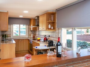 Cabinetry, Countertop, Wood, Kitchen Appliance, Kitchen, Kitchen Stove, Interior Design, Wood Stain, Flooring, Floor
