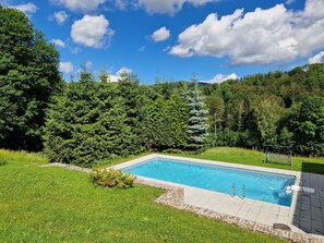 Water, Cloud, Sky, Plant, Swimming Pool, Natural Landscape, Land Lot, Tree, Vegetation, Shrub