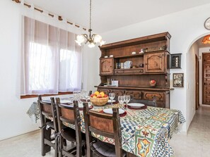 Table, Furniture, Property, Cabinetry, Building, Interior Design, Lighting, Chair, Picture Frame, Wood