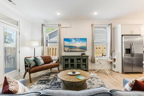 Relaxation central! Sink into the sofa, catch your favorite shows on the TV, and gather around the coffee table in our inviting living room.