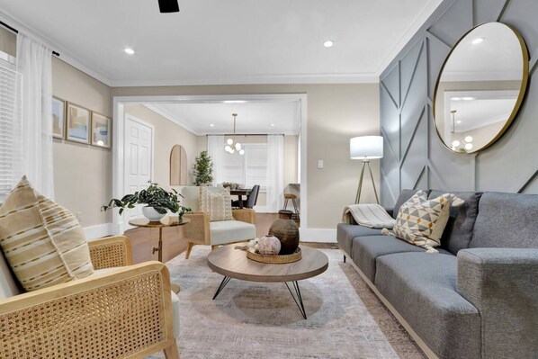 Experience elegance and entertainment combined in our gorgeous living room, featuring a 65-inch TV for an immersive viewing experience. 