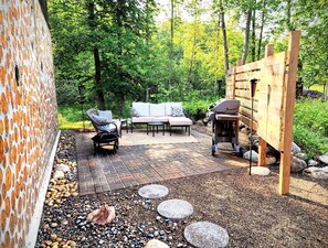 Private patio space with gas grill