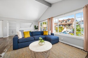 Bright and welcoming living room with ample natural light and stylish decor
