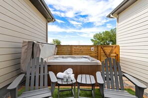 Backyard | Private Hot Tub and Plentiful Lounge Chairs