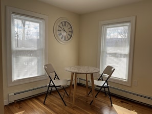 Cozy dining area with natural light (4 new chairs to come)